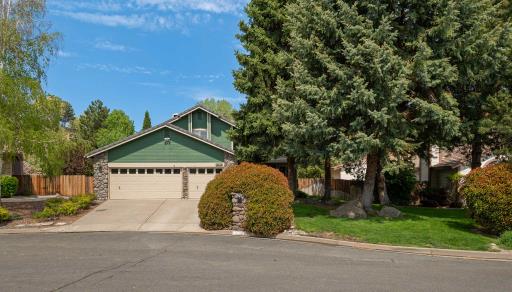 Front exterior of a home with a green garage door